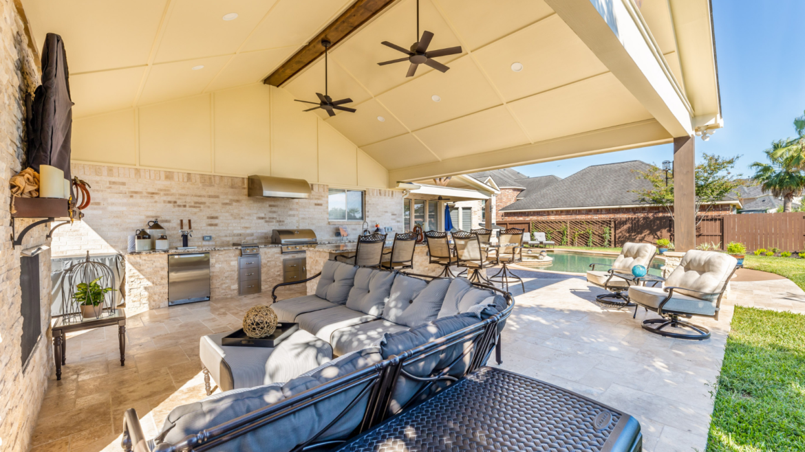 outdoor oasis: amazing outdoor space with outdoor kitchen, fireplace, patio cover, tv, and more
